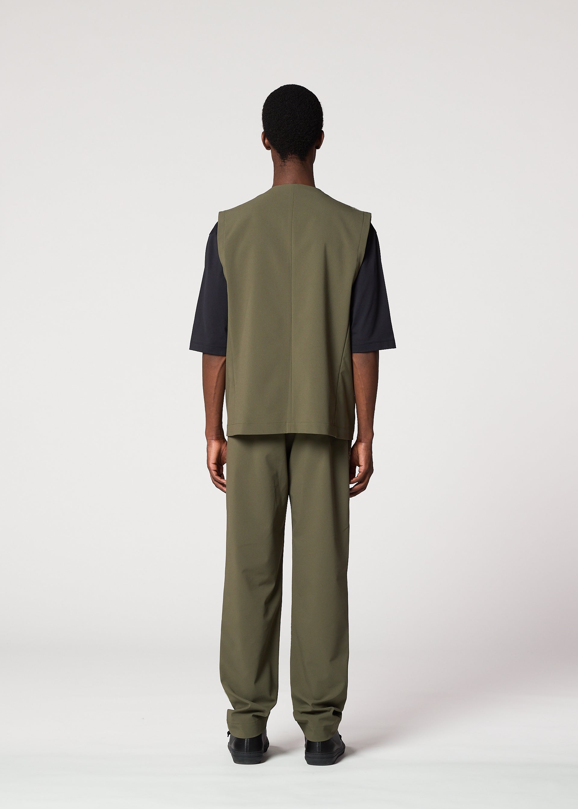 A model wears the IM Men KAIYU trousers.