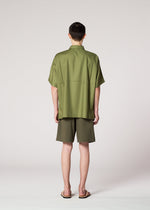 A model wears the IM Men KAIYU trousers.