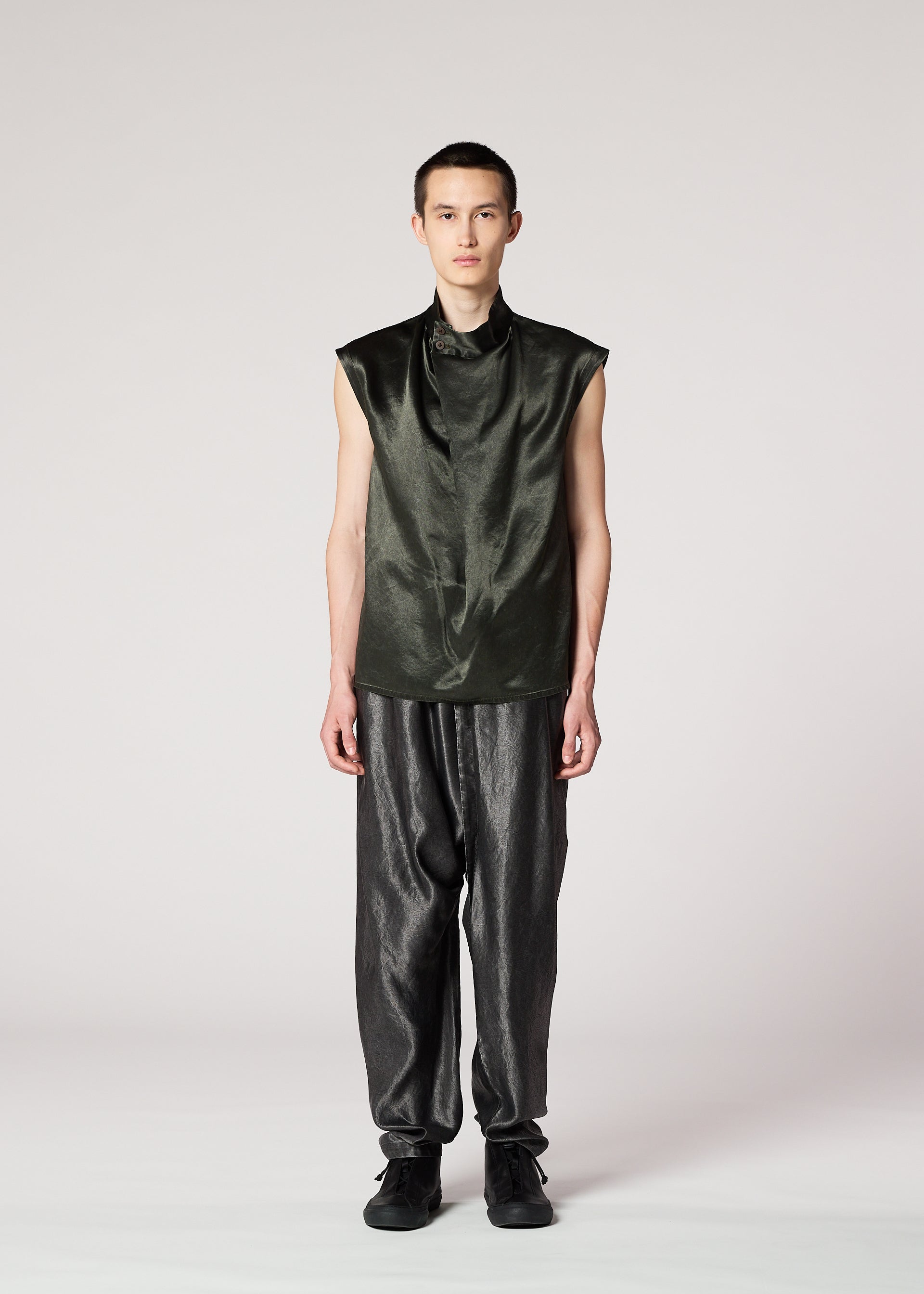 A model wears the IM Men SATIN WASH trousers.