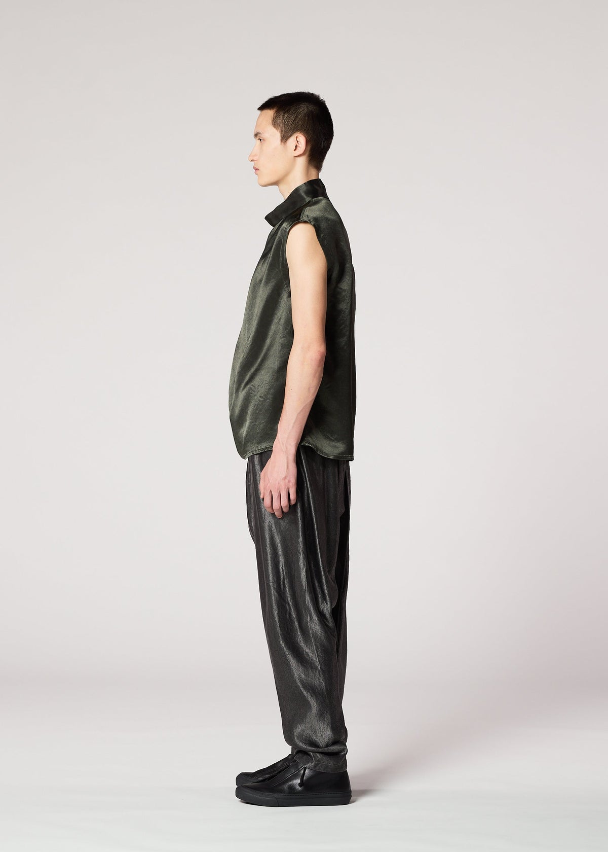 A model wears the IM Men SATIN WASH trousers.