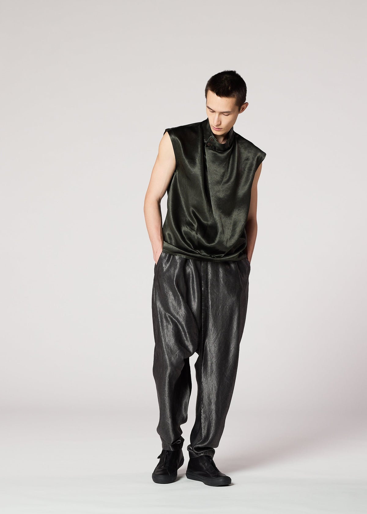 A model wears the IM Men SATIN WASH trousers.