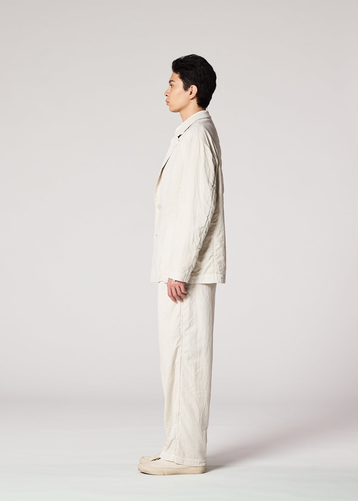 A model wears the IM Men PIGMENT DOUBLE FACE COTTON pants.