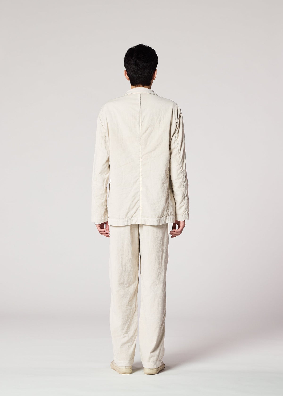 A model wears the IM Men PIGMENT DOUBLE FACE COTTON pants.