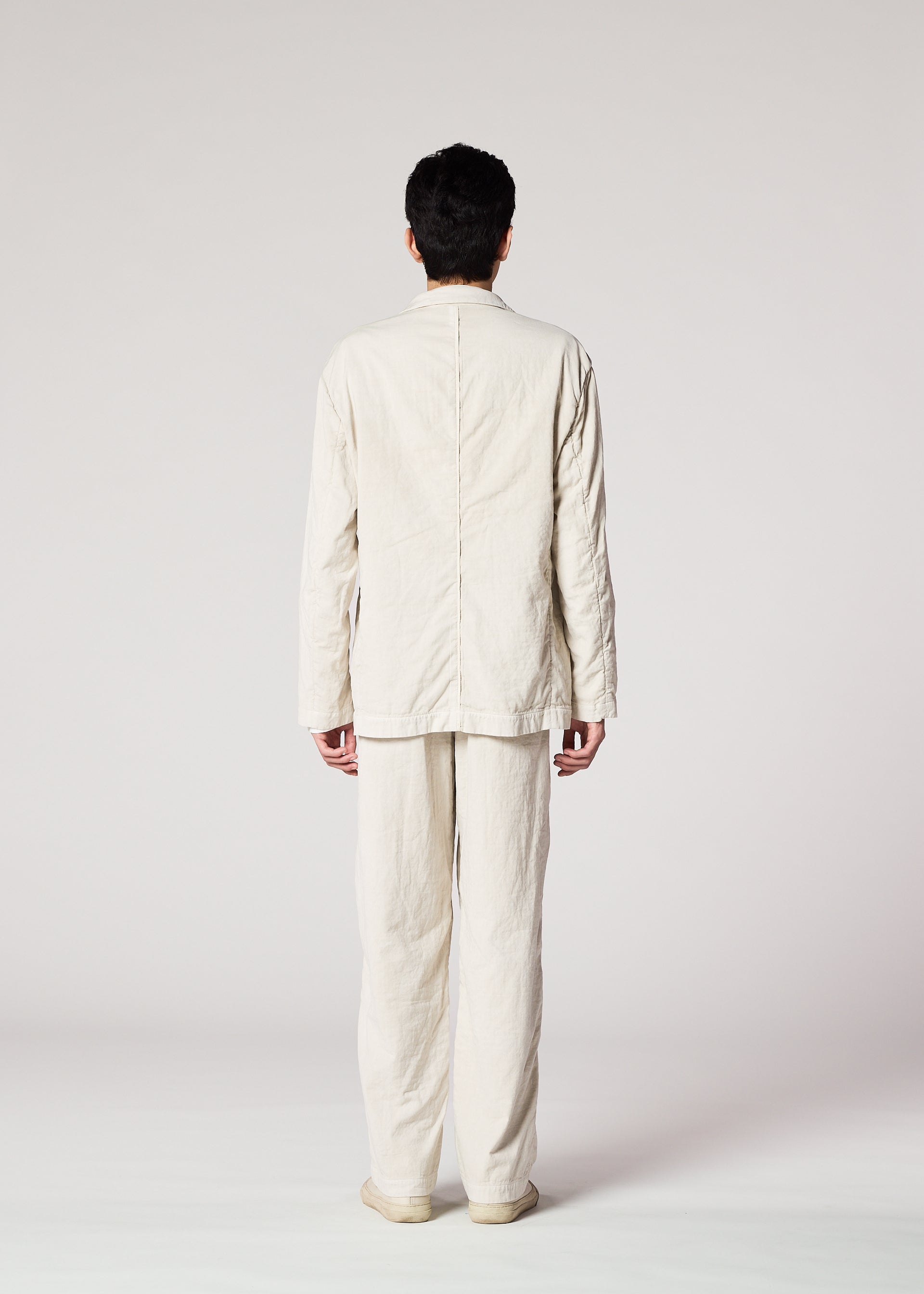A model wears the IM Men PIGMENT DOUBLE FACE COTTON pants.