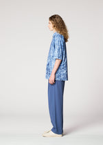 A model wears the IM MEN NAVY BOTTOMS navy-bottoms-trousers-dark-dark-brown.