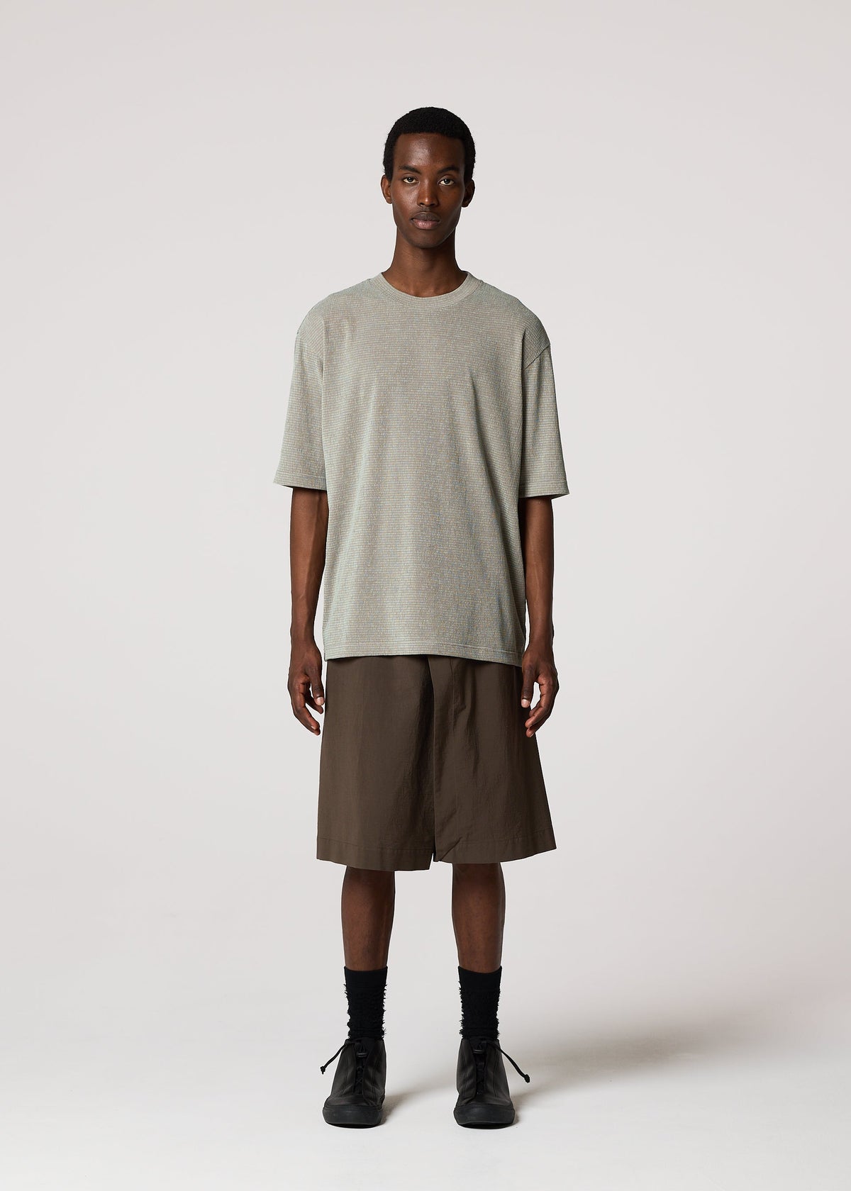 A model wears the IM MEN NAVY BOTTOMS navy-bottoms-trousers-light-grey-1.