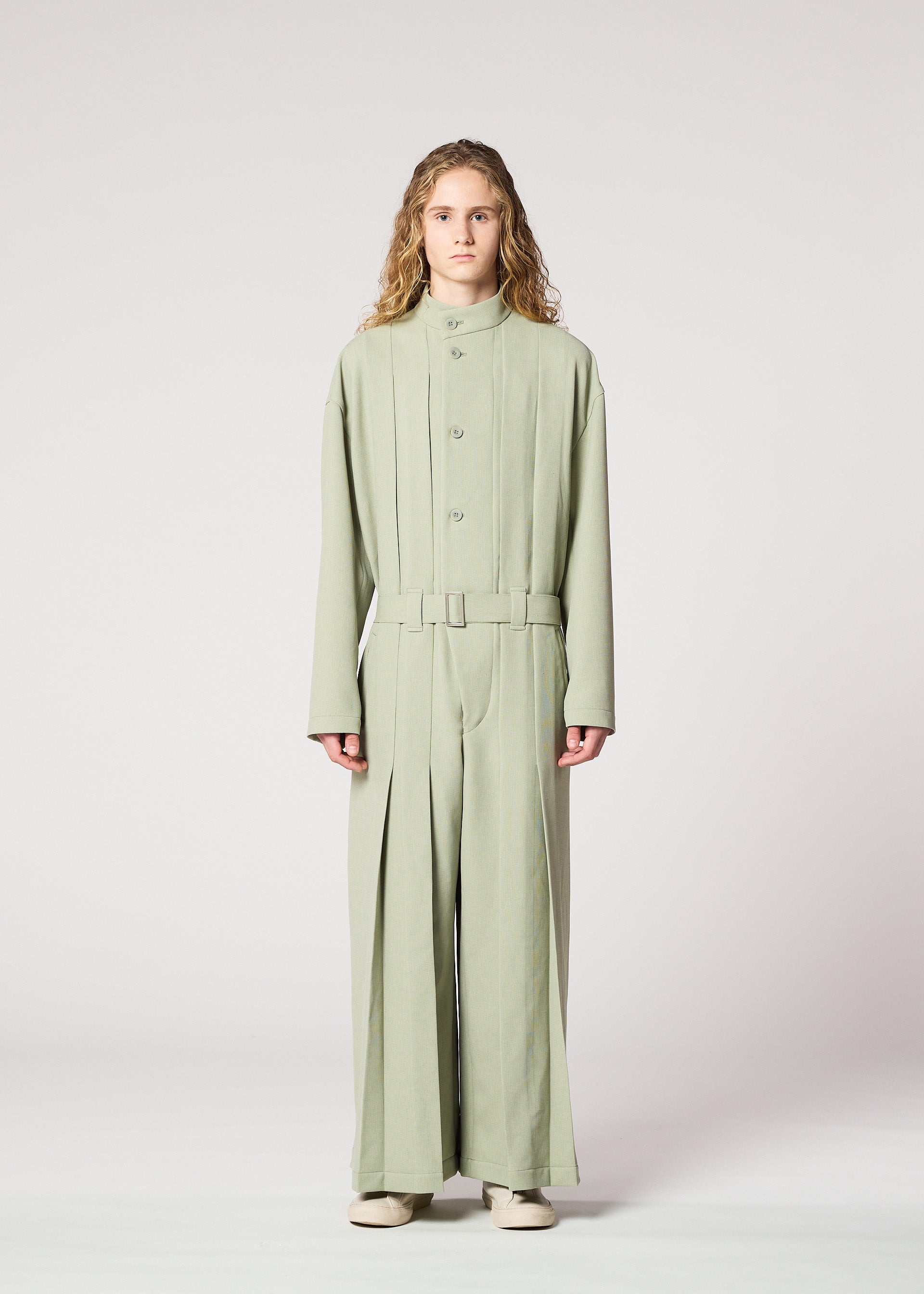A model wears the IM Men CORNICE jumpsuit.