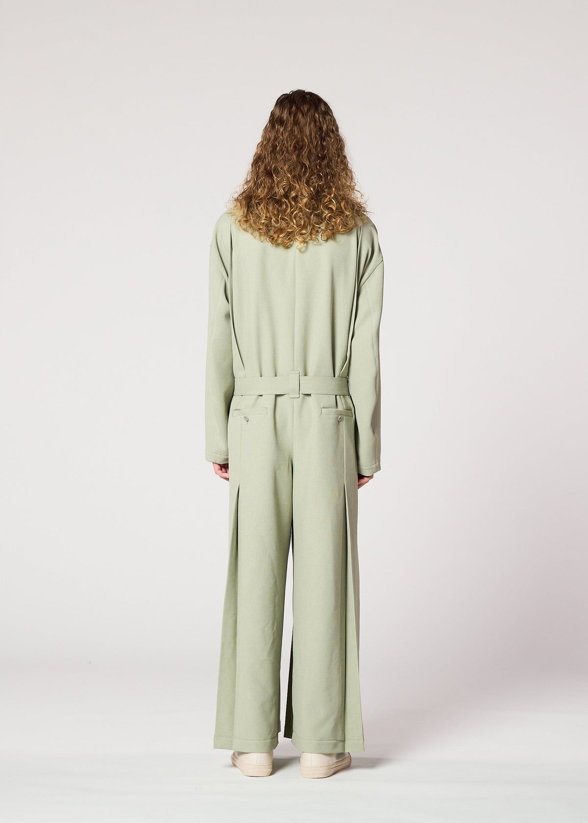 A model wears the IM Men CORNICE jumpsuit.