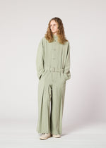 A model wears the IM Men CORNICE jumpsuit.