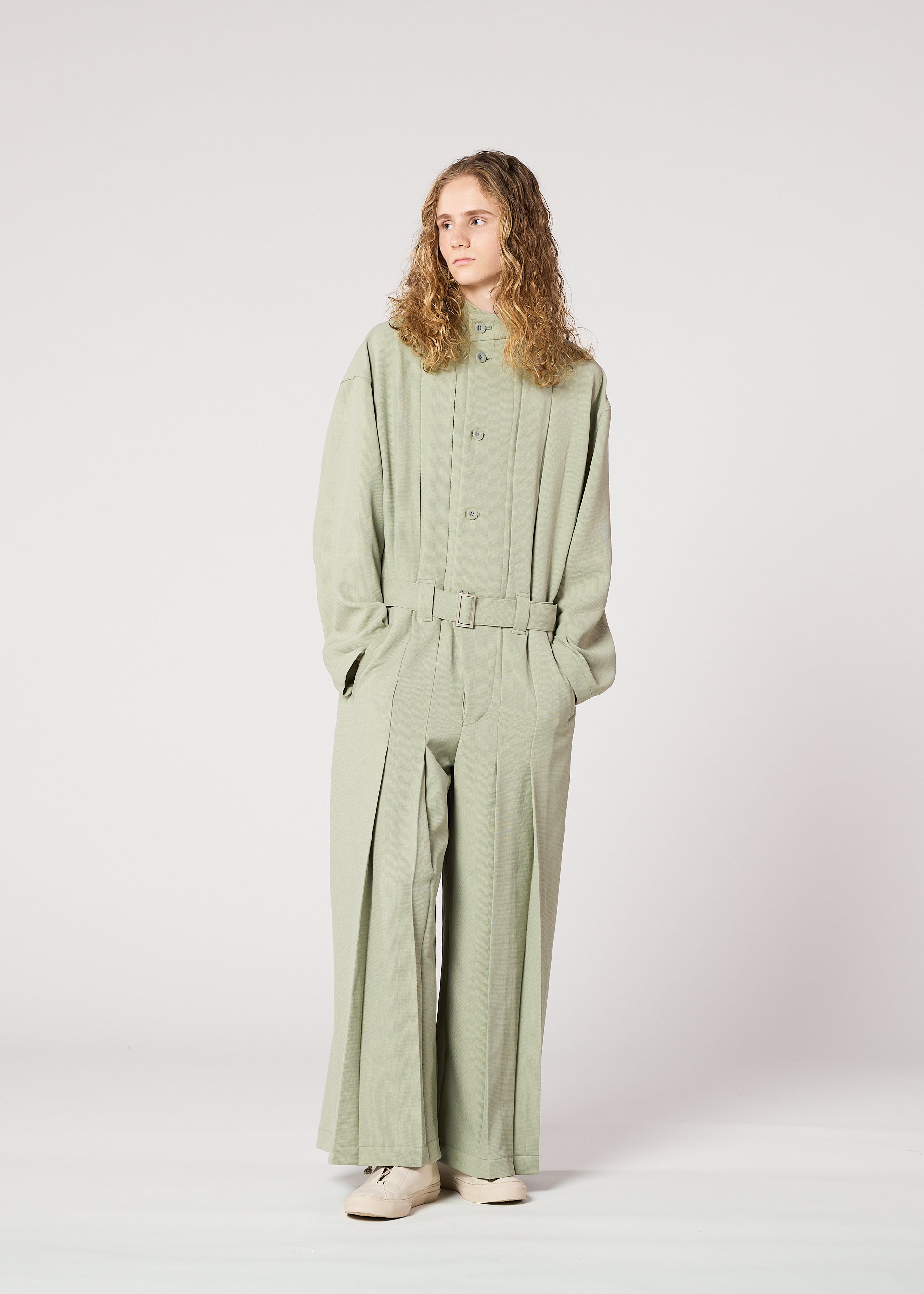 A model wears the IM Men CORNICE jumpsuit.