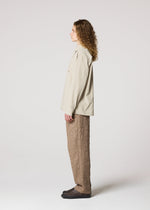 A model wears the IM MEN WHITE SHIRT prêt à porter.