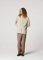 A model wears the IM MEN WHITE SHIRT prêt à porter.