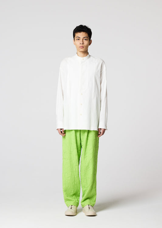 A model wears the IM MEN WHITE SHIRT prêt à porter.