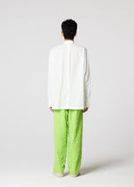 A model wears the IM MEN WHITE SHIRT prêt à porter.