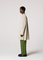 A model wears the IM MEN WHITE SHIRT prêt à porter.