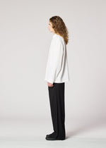 A model wears the IM MEN ONE SIDE TUCK SHIRT prêt à porter.