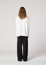 A model wears the IM MEN ONE SIDE TUCK SHIRT prêt à porter.