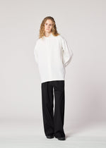 A model wears the IM MEN ONE SIDE TUCK SHIRT prêt à porter.