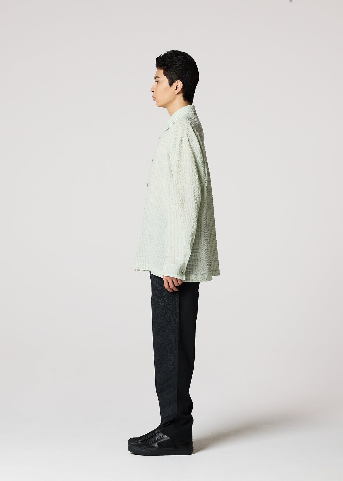 A model wears the IM Men STRIPE LINEN SHRINK shirt.