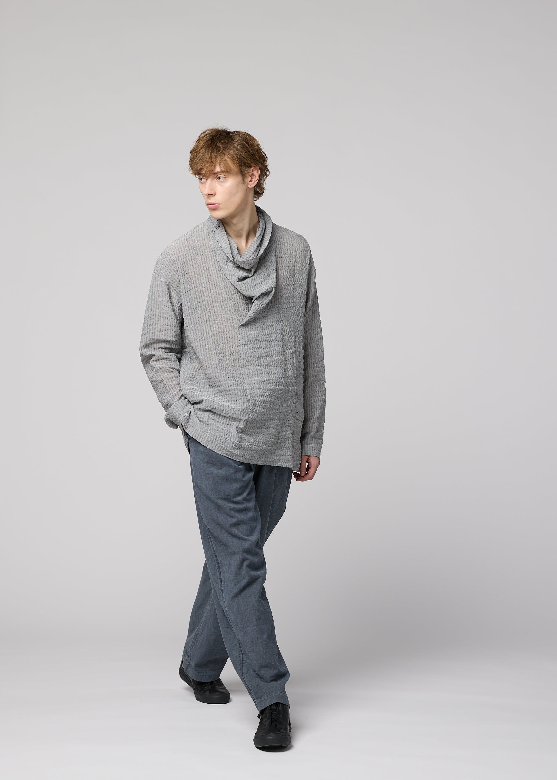 A model wears the IM Men STRIPE LINEN SHRINK shirt.