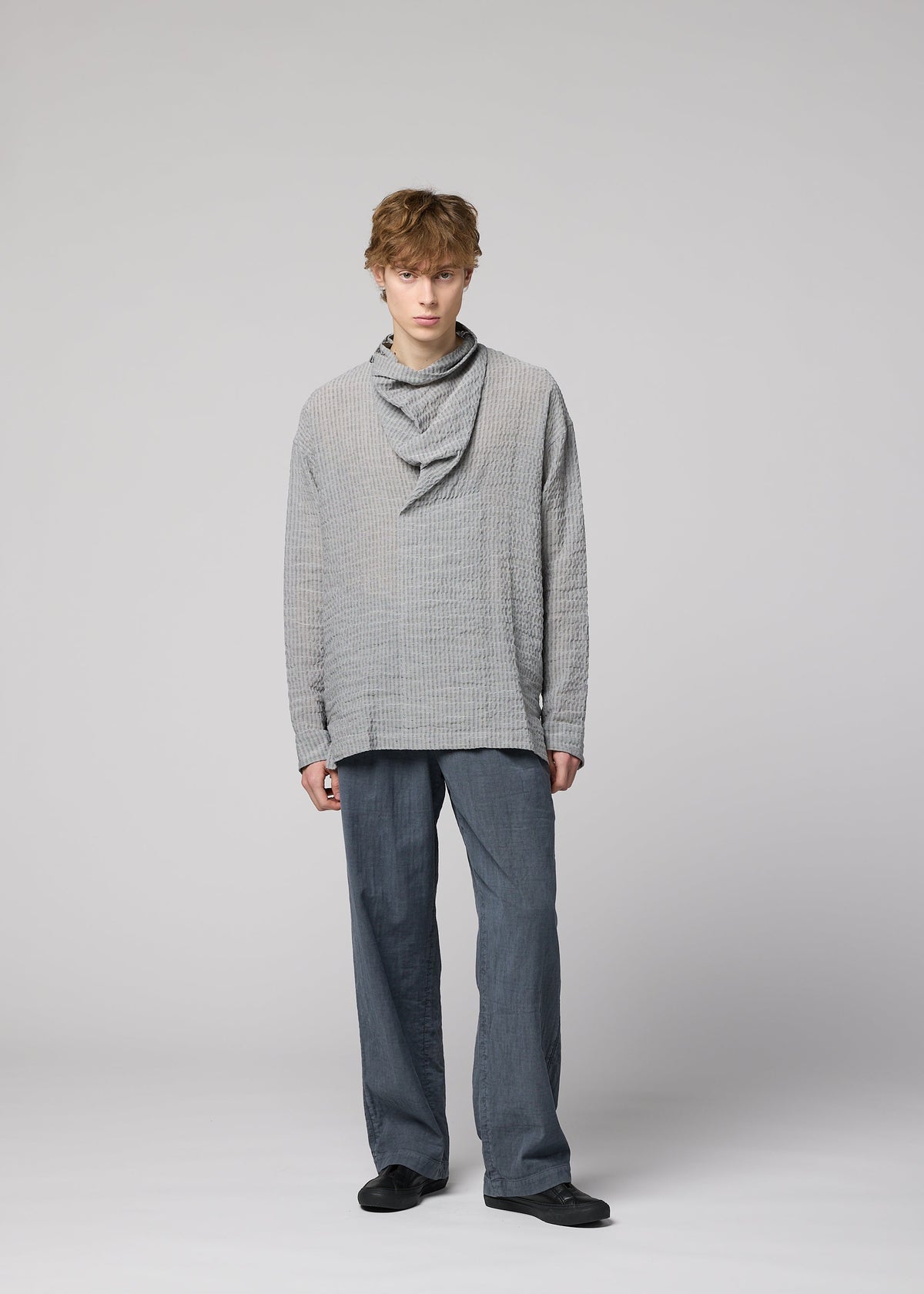 A model wears the IM Men STRIPE LINEN SHRINK shirt.