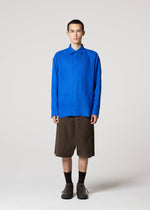 A model wears the IM MEN FLOATING LINEN floating-linen-shirt-dark-navy-2.
