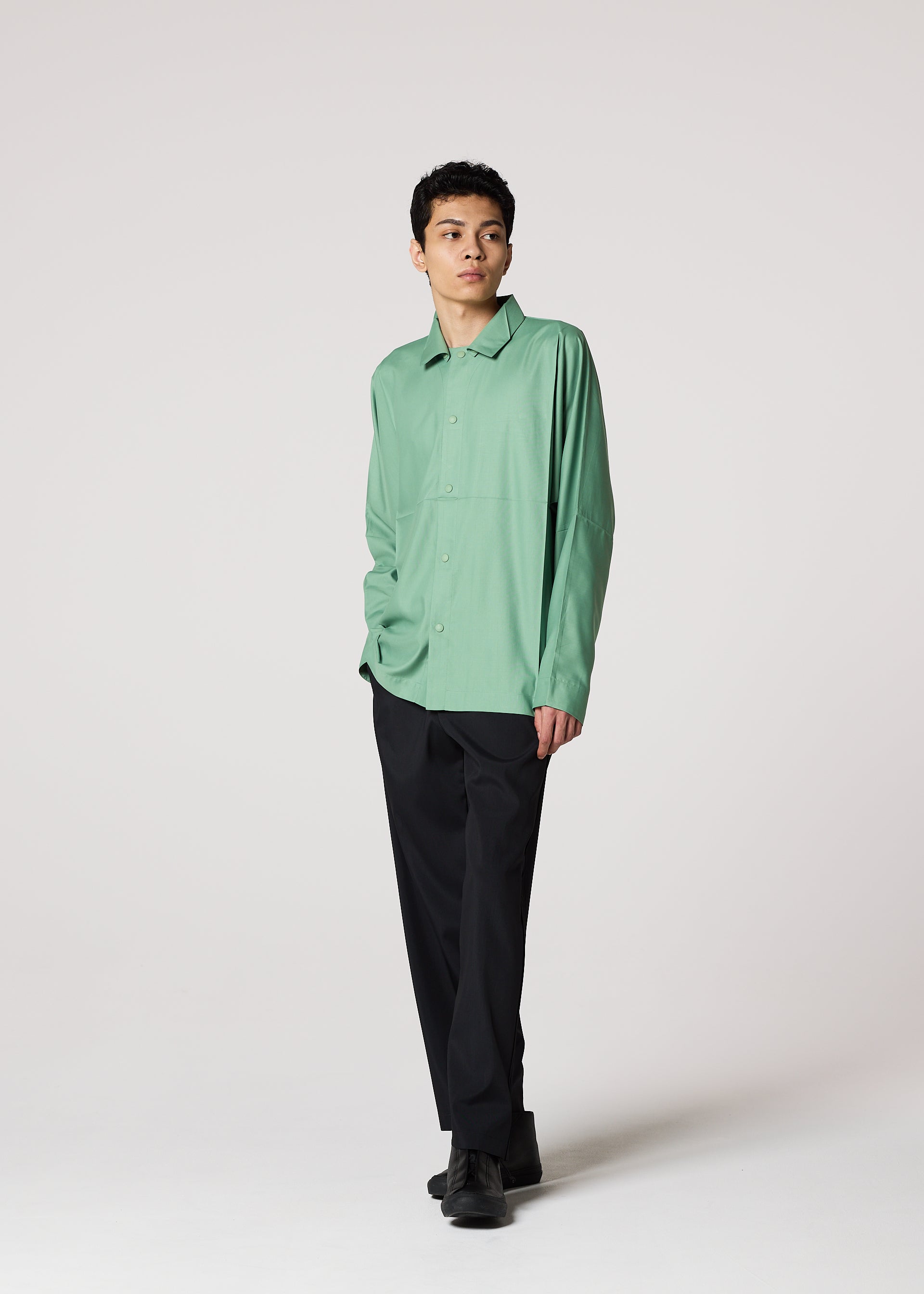 A model wears the IM Men COMPACT SHIRT shirt.