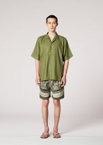 A model wears the IM Men COMPACT SHIRT shirt.