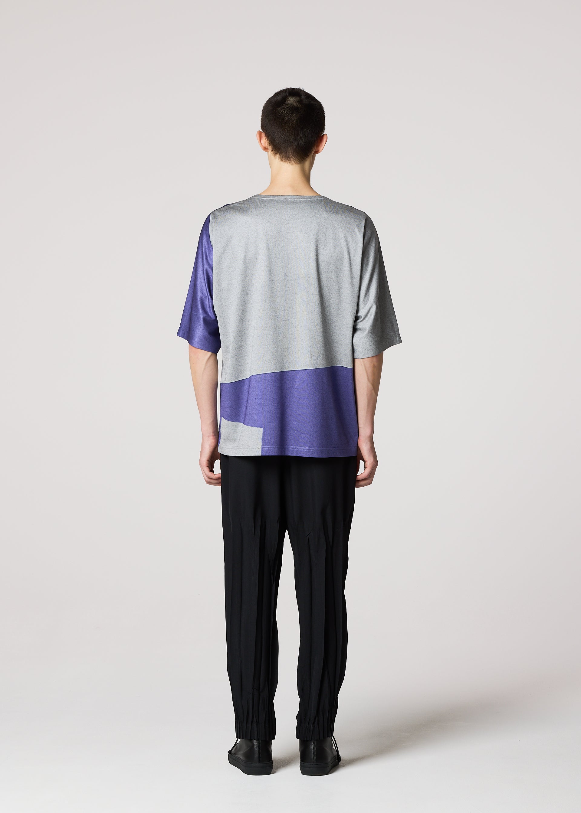 A model wears the IM Men GEOMETRY PLATING JERSEY t shirt.