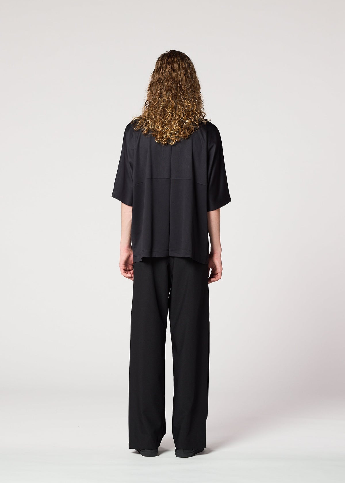 A model wears the IM Men FLAT T t shirt.