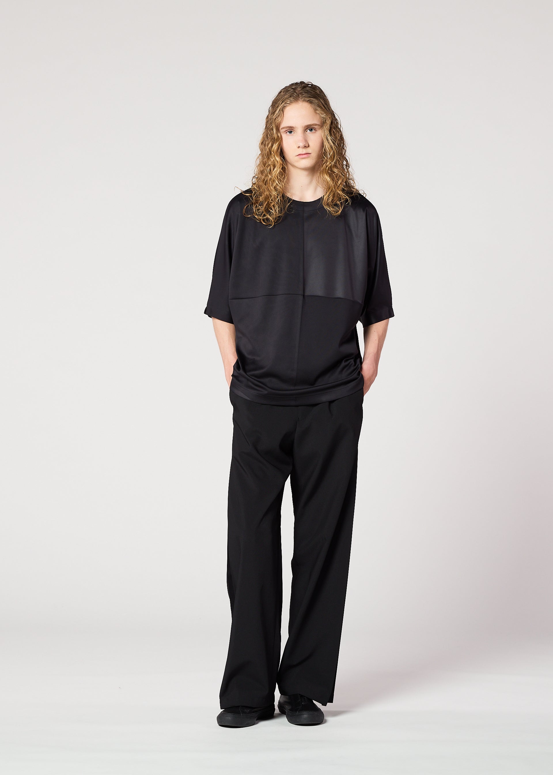 A model wears the IM Men FLAT T t shirt.