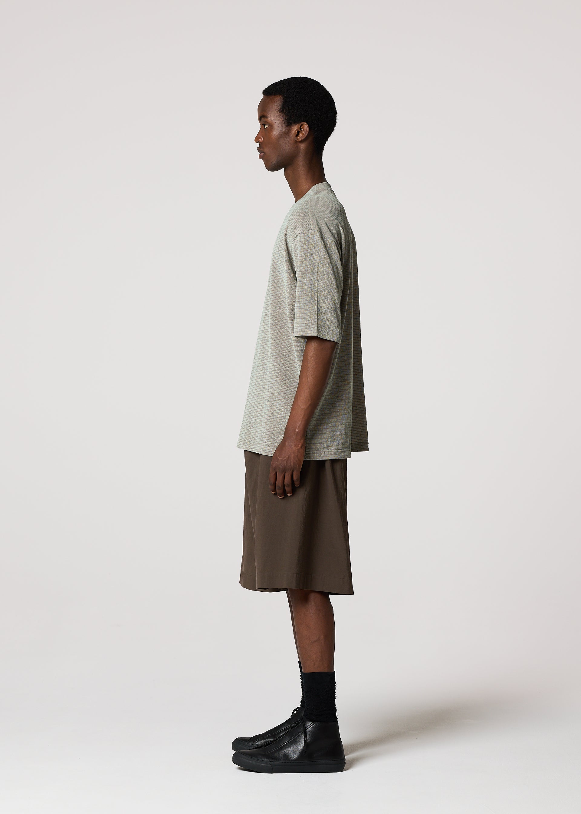 A model wears the IM MEN SHRINK STRETCH T shrink-stretch-t-t-shirt-sage-green.
