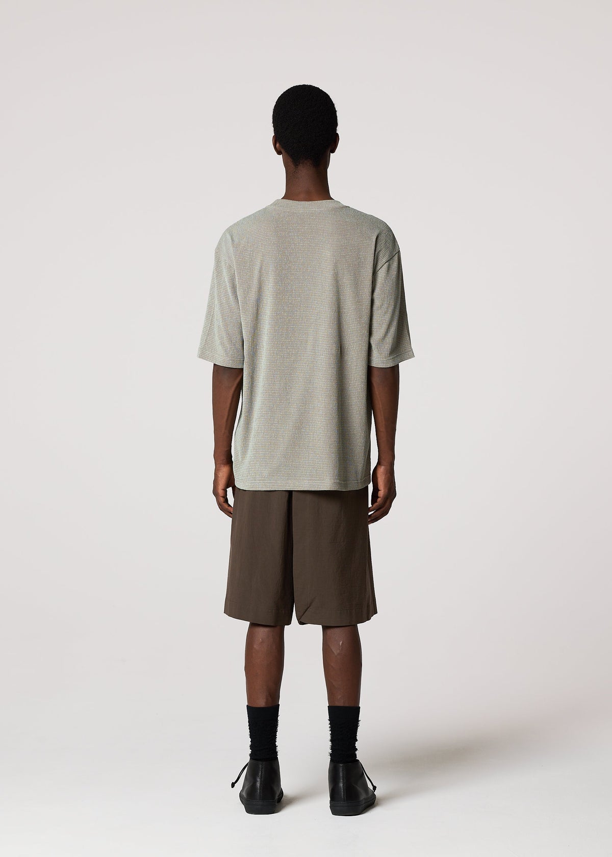 A model wears the IM MEN SHRINK STRETCH T shrink-stretch-t-t-shirt-dark-brown.