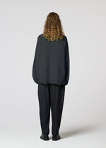 A model wears the IM MEN ENGRAVE KNIT prêt à porter.