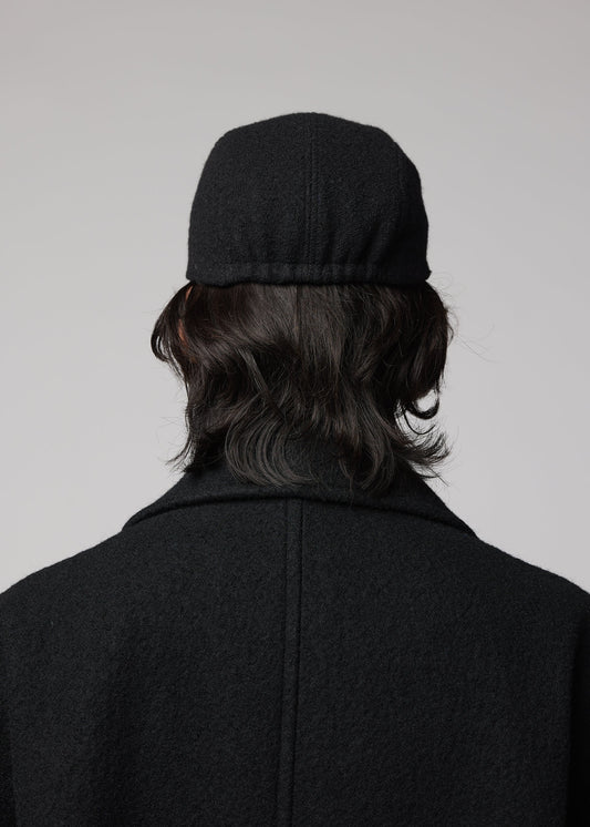 A model wears the IM MEN FULLER WOOL CAP cap.