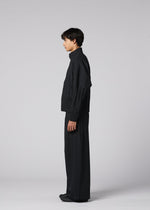 A model wears the IM MEN WAFT BLACK waft-black-trousers-black-1-fw26.