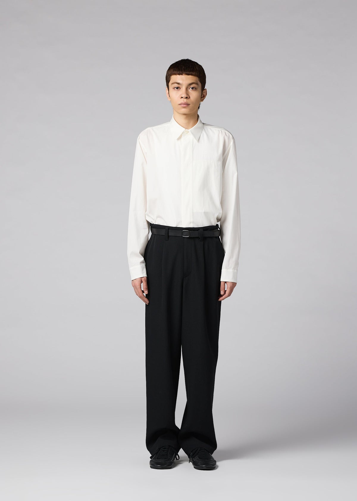 A model wears the IM MEN FRONT BACK trousers.