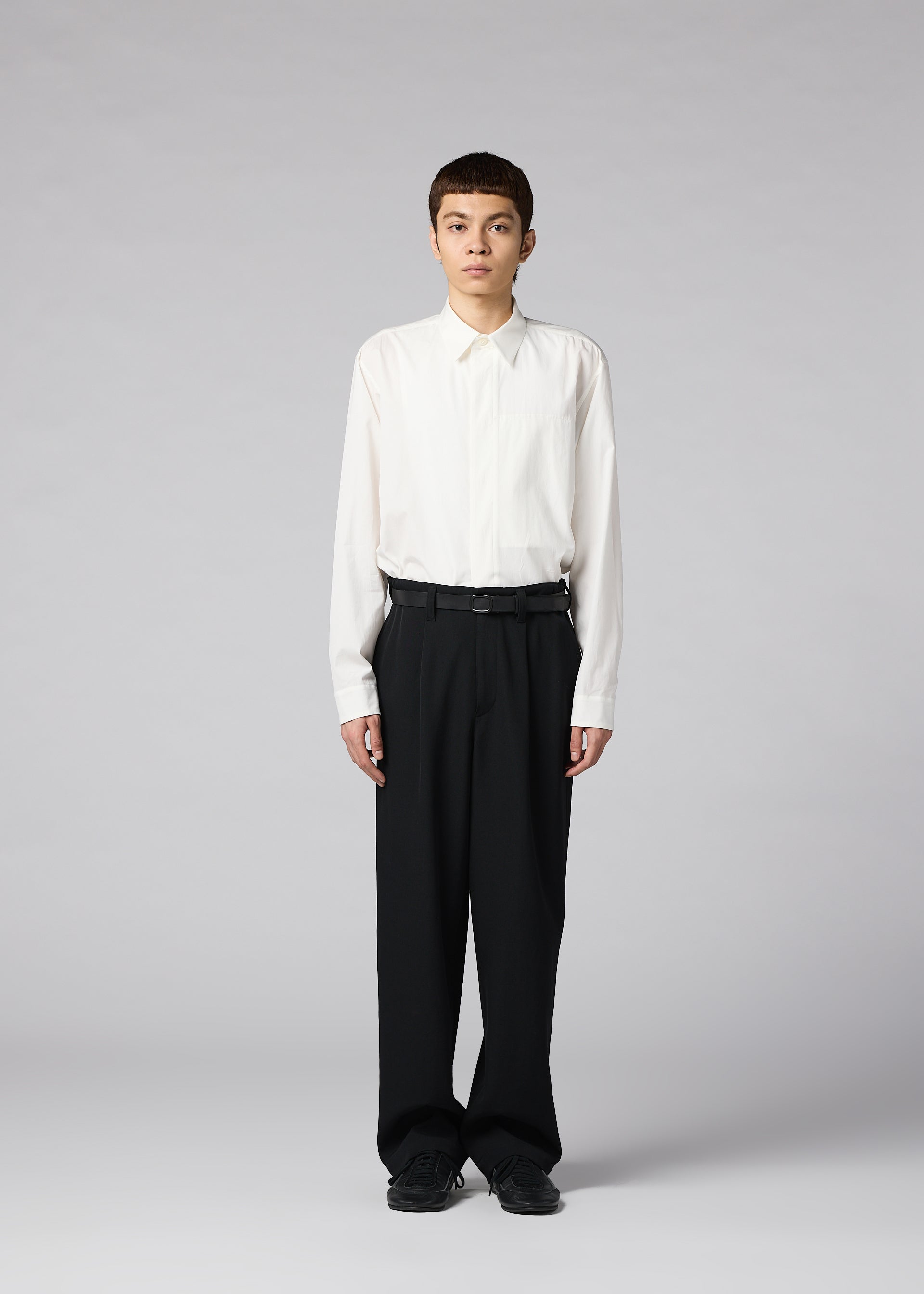 A model wears the IM MEN FRONT BACK trousers.