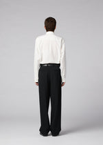 A model wears the IM MEN FRONT BACK trousers.
