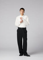 A model wears the IM MEN FRONT BACK trousers.