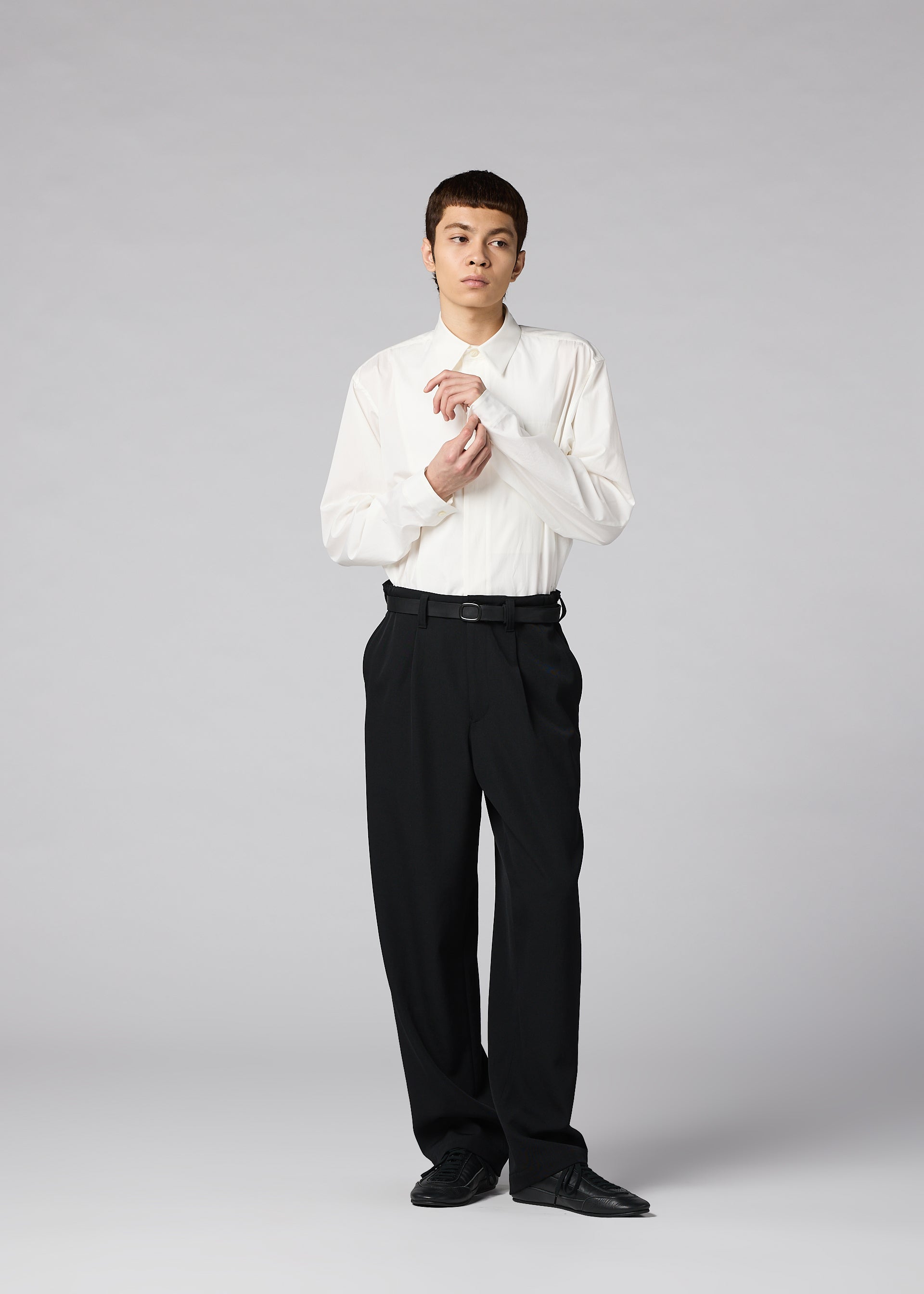A model wears the IM MEN FRONT BACK trousers.