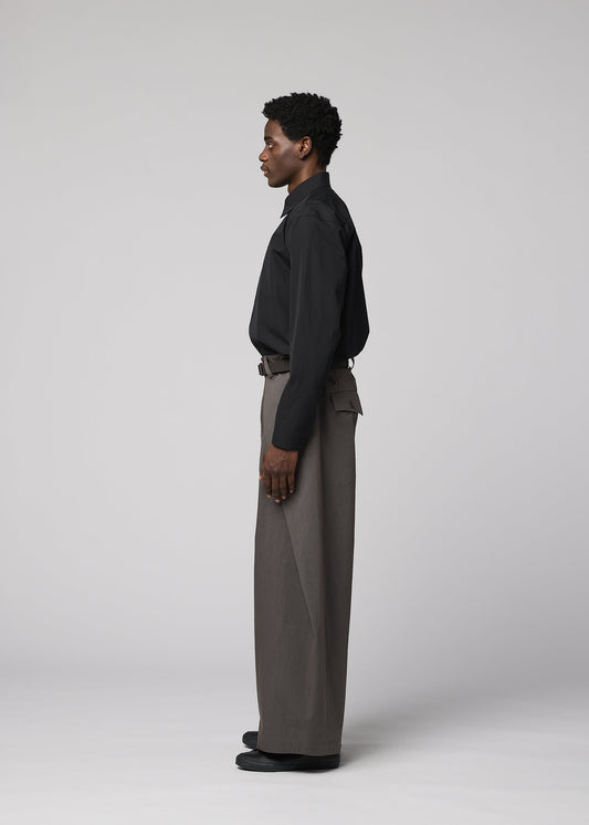 A model wears the IM MEN OVERLAP overlap-trousers-navy-1.