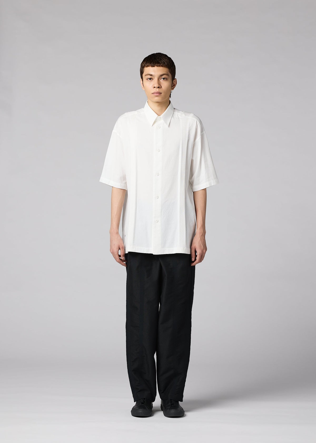 A model wears the IM MEN CLAY SHIRT clay-shirt-shirt-white-2.