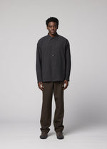 A model wears the IM MEN DOUBLE WEAVE CREPE shirt.