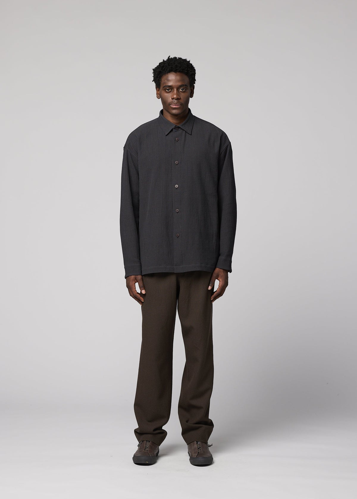 A model wears the IM MEN DOUBLE WEAVE CREPE shirt.