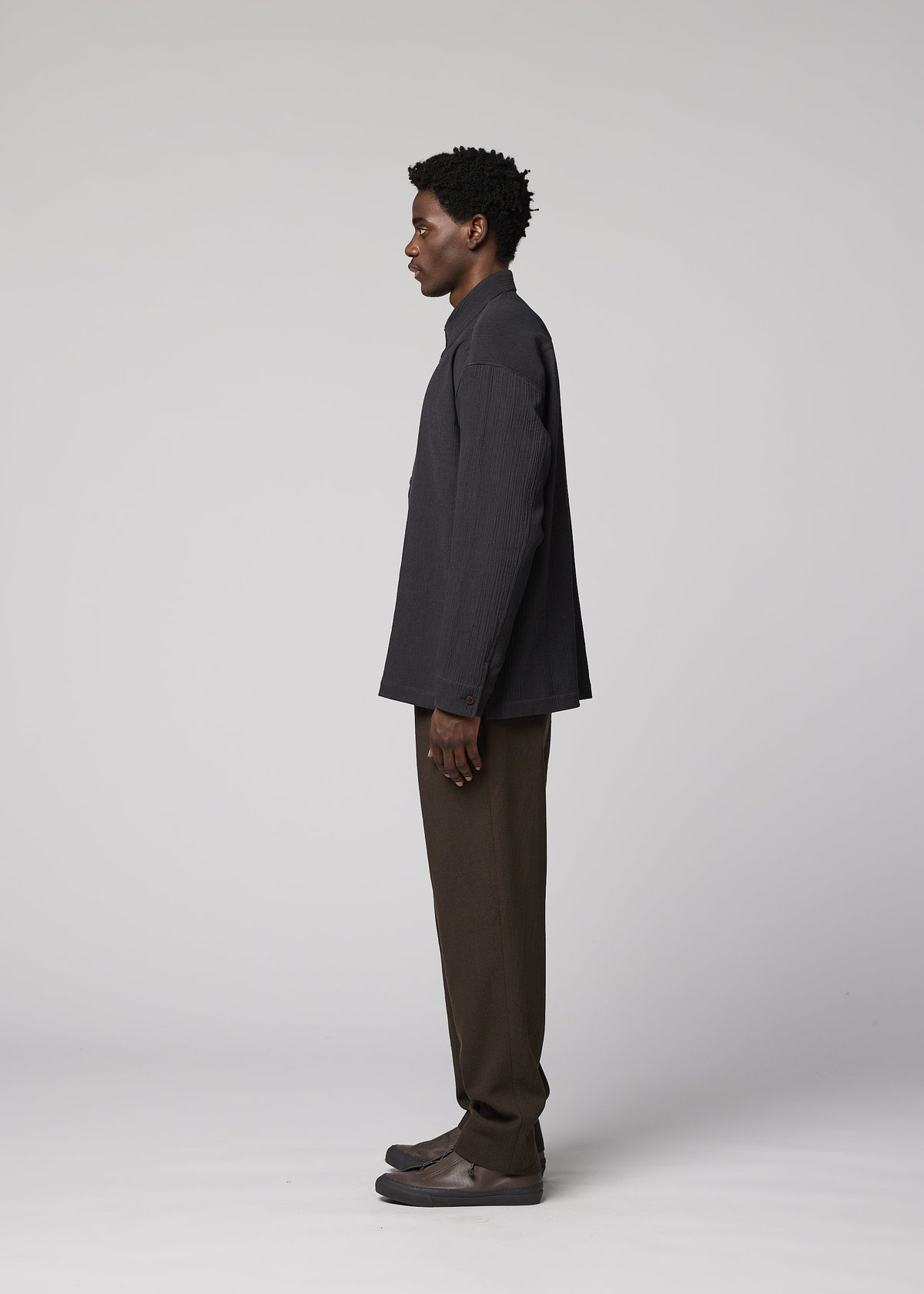 A model wears the IM MEN DOUBLE WEAVE CREPE shirt.