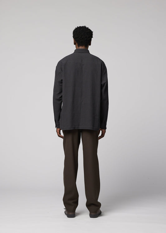 A model wears the IM MEN DOUBLE WEAVE CREPE shirt.