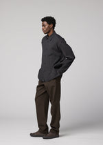 A model wears the IM MEN DOUBLE WEAVE CREPE shirt.