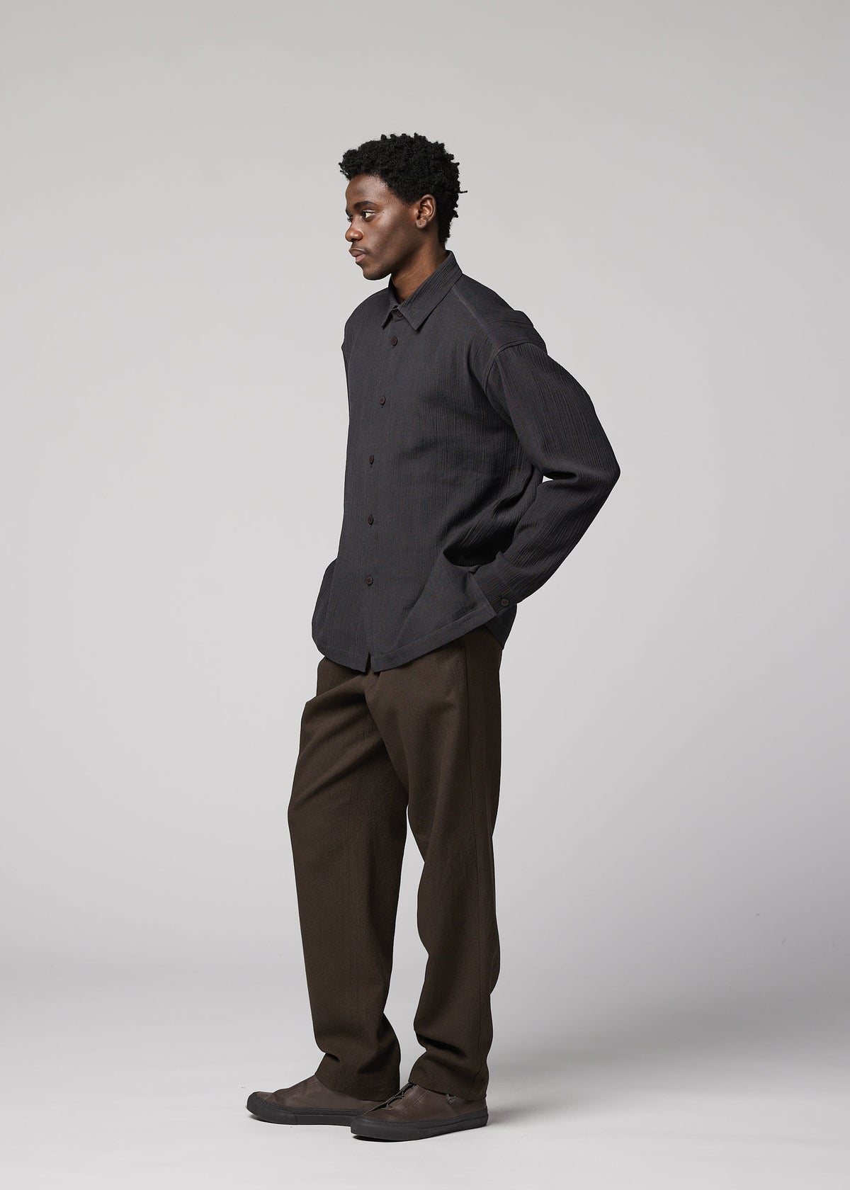 A model wears the IM MEN DOUBLE WEAVE CREPE shirt.