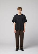 A model wears the IM MEN TURN turn-t-shirt-white.